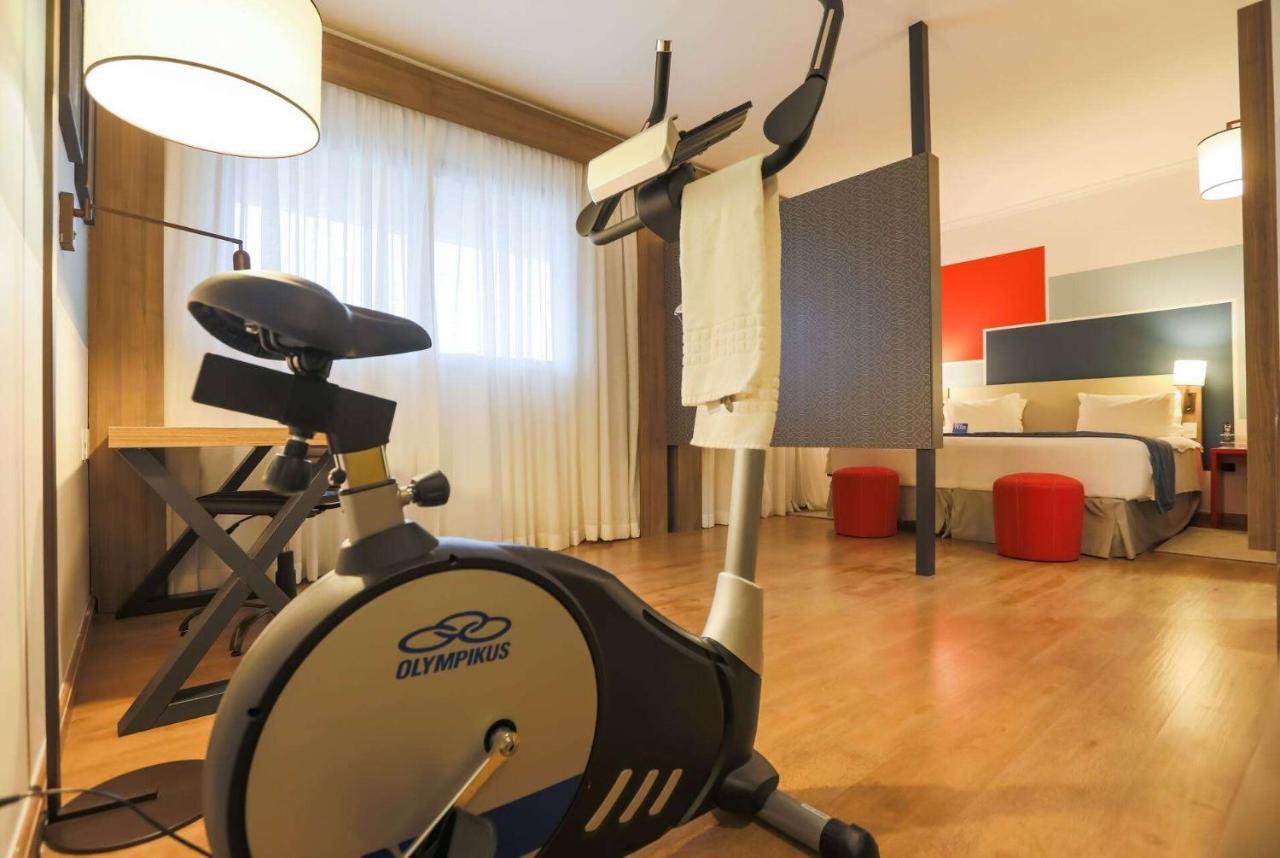 Hotel Tryp By Wyndham Ribeirão Preto Exterior foto An exercise bike in a hotel room